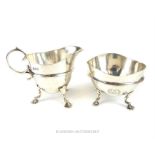 A matching Victorian hallmarked sterling silver milk jug and sugar bowl, assayed in London in 1892