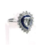 An 18 ct white gold, pear-shaped diamond and sapphire cluster ring