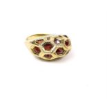 A 9 ct yellow gold, garnet and diamond, honeycomb, bombe ring