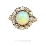 A spectacular, antique, natural opal and diamond cluster ring