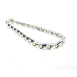 An 18 ct white gold, diamond set tennis bracelet (3.47 carats)