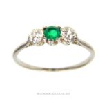 An early 19th century, white metal (tested as platinum), emerald and diamond ring