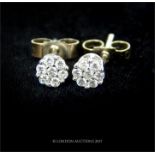 A pair of elegant, 18 ct white gold, diamond stud earrings