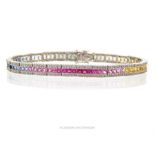 An exquisite, 18 ct white gold, sapphire (multi-coloured) and diamond set bracelet
