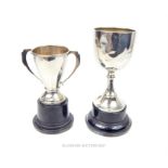 Two sterling silver trophy cups on stands
