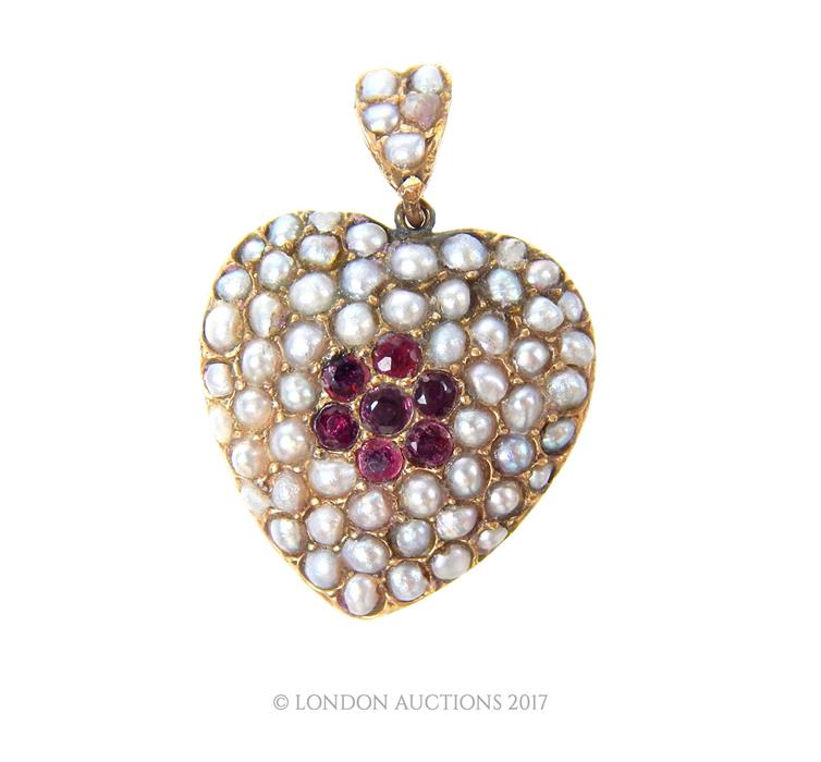 A Victorian, 9 ct yellow gold, ruby and seed pearl studded heart-shaped pendant