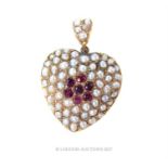 A Victorian, 9 ct yellow gold, ruby and seed pearl studded heart-shaped pendant