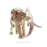 A Zimbabwe sterling silver miniature model of an elephant, probably by Patrick Mavros