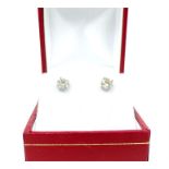 A boxed, pair of white gold and diamond stud earrings (totalling 0.83 carats)