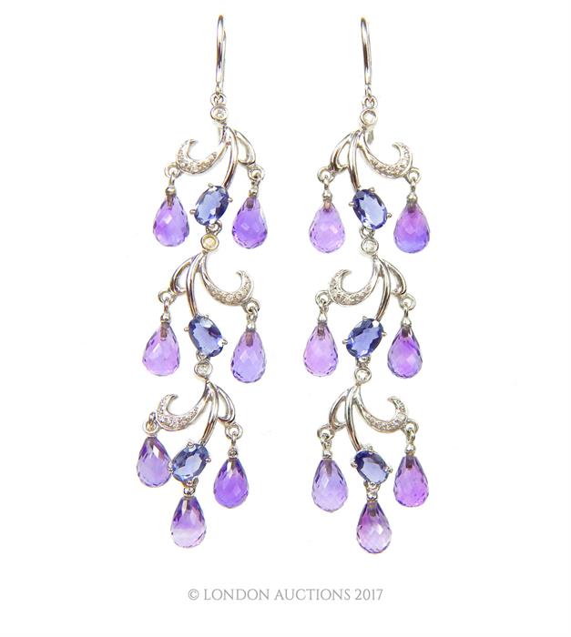 A boxed pair of 18 ct white gold, diamond, amethyst an iolite chandelier drop earrings