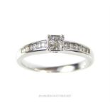 A fine, boxed, 18 ct white gold and diamond solitaire style ring