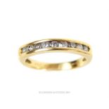 An elegant, 18 ct yellow gold ring set with nine, round, brilliant-cut diamonds