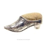 A late Victorian sterling silver pin cushion in the form of a shoe