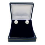 A pair of very large, 18 ct white gold, diamond stud earrings