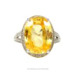 A spectacular, 18 ct white gold, yellow topaz and diamond dress ring