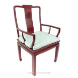 A Chinese, hardwood hall chair with mint green fitted seat cushion