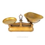 A set of W & T Avery Ltd of Birmingham gilded cast iron weighing scales