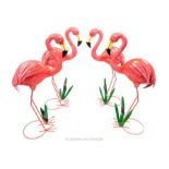 A set of four painted metal ware flamingos; 78 cm high.
