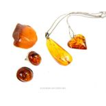 A pair of silver and amber cuff links
