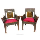 A pair of armchairs, having carved back and arm panels