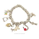 A sterling silver, 'Links of London' charm bracelet with seven silver charms