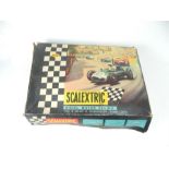 A collection of vintage Tri-ang Scalextric track and instructions with original box; without cars;