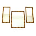 A set of three circa 1910 rectangular mirrors, having gilded frames