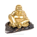 A fine, large, brass Buddha, (mid-20th century) on a carved wooden stand