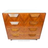 A mid 20th century Continental walnut chest of four long drawers, having a glass top