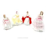 Four Royal Doulton figures of ladies