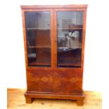 An Art Deco walnut veneered bookcase