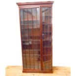 A large mahogany bookcase having two glazed doors