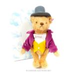 A Steiff soft toy Willy Wonka teddy bear, with articulated limbs and original box.