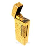A Dunhill gold plated cigarette lighter