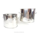 A pair of silver plated oval twin handled wine coolers