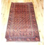 A Persian rug, having repeating tiles of red hue