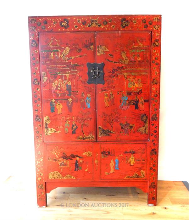 A Chinese red lacquered cabinet