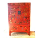 A Chinese red lacquered cabinet