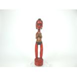 A 20th century tribal African carved light wood, female fertility figure
