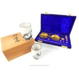 A boxed, set of brass scales and weights and two Japanese cups