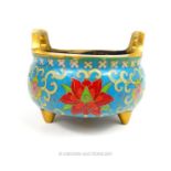 A Chinese twin handled cloisonne and gilt brass censer