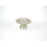 An early 20th century, finely chased, engraved & pieced silver pedestal bowl for an altar,