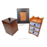 A wooden framed jewellery chest with three delft ceramic drawers (25.5cm high); a hardwood lidded