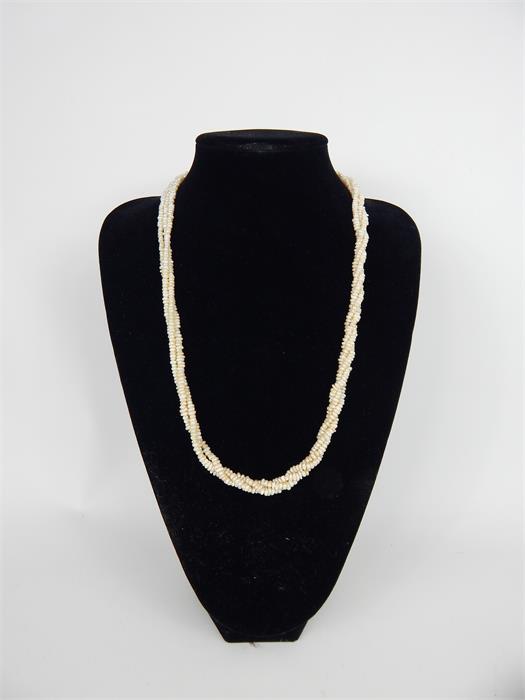 A 9ct yellow gold clasped, rope twist necklace of freshwater pearls