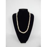 A 9ct yellow gold clasped, rope twist necklace of freshwater pearls