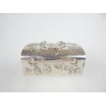 A Chinese Silver-Covered Dome-shaped Box decorated with birds, peony and other prosperous symbols;