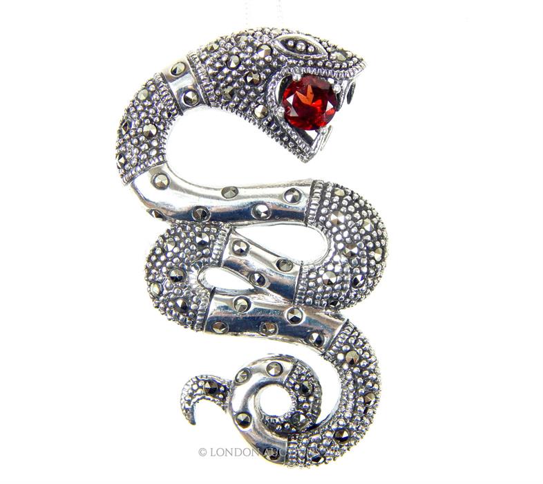 An unusual silver marcasite and large Garnet snake pendant with silver chain, both stamped 925; 5 cm