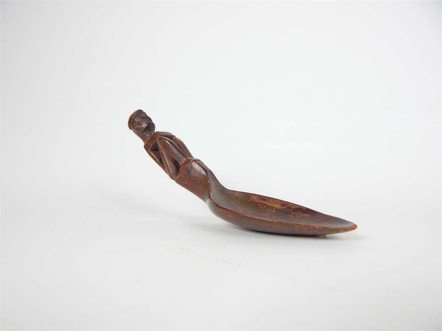 A 20th century carved ritual wooden spoon of the Ifugao People, Luzon, Philippines; 15cm long.