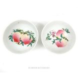 A pair of small Chinese porcelain dishes, hand painted in the famille rose palette