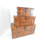 A graduated set of three metal bound teak coffers